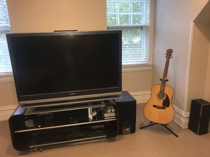 Sony TV $150, 
Onkyo receiver/speakers- theatre system $150, 
Entertainment stand $175, 
Fender guitar with stand $200