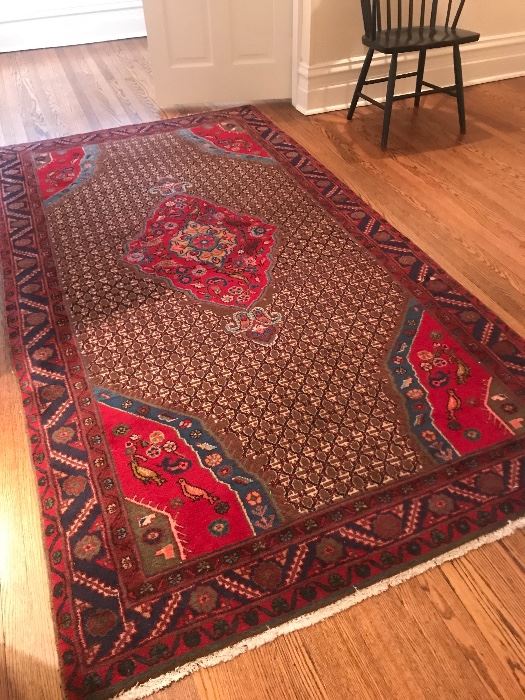 Beautiful vibrant area rug with bird motif 4’11” x 9’3”
$1200
