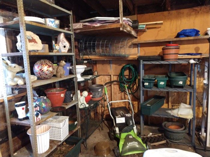 Lawn vacuum, baker's rack, gardening supplies, shelves