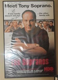 Soprano Full Cast Signed Framed Poster.This "The Sopranos" Movie Poster is signed by 10 Members of Cast including James Gandolfini, Edie Falco, Dominic Chianese, Michael Imperioli, Jamie-Lynn Sigler, Tony Sirico, Steven Van Zandt, Federico Castelluccio, Loraine Bracco and Salvatore Bonpensiero starring in this movie. The poster measures approximately 31" x 44". .