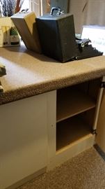 Large work table with storage. Carpeted top lifts off for moving. Two available.