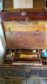 Beautiful old trunk. Top trunk in picture stores inside. Filled with tools