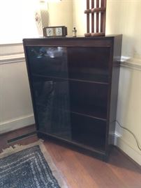 3 drawer book shelf or display case with glass doors. 
