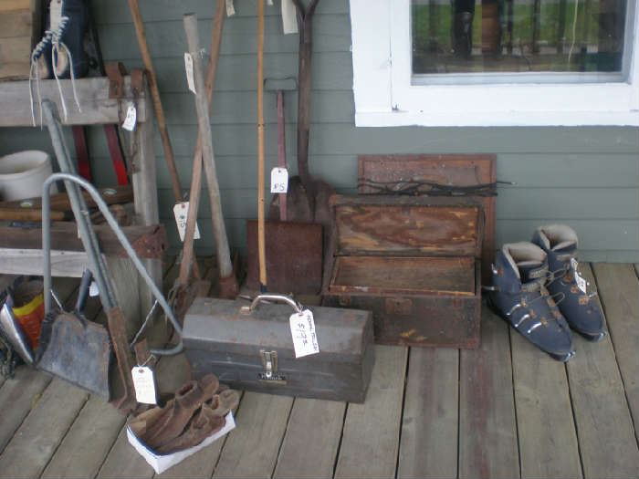 Tool boxes, ski boots to decorate, shoemaker forms, hanging rack, kids snow shovel, adz, shovel to decorate.