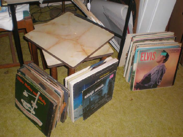 Stack tables, records. There will be a bundle price on records. Elvis records are sold.