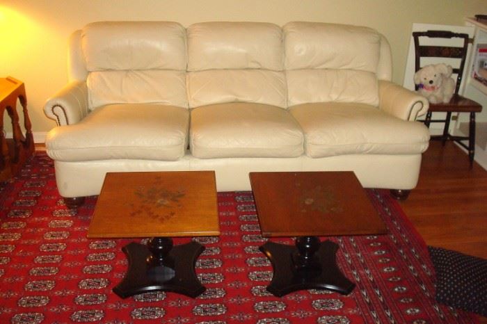 White leather sofa, pair Hitchcock end tables and partial view room size Bokara Persian rug.