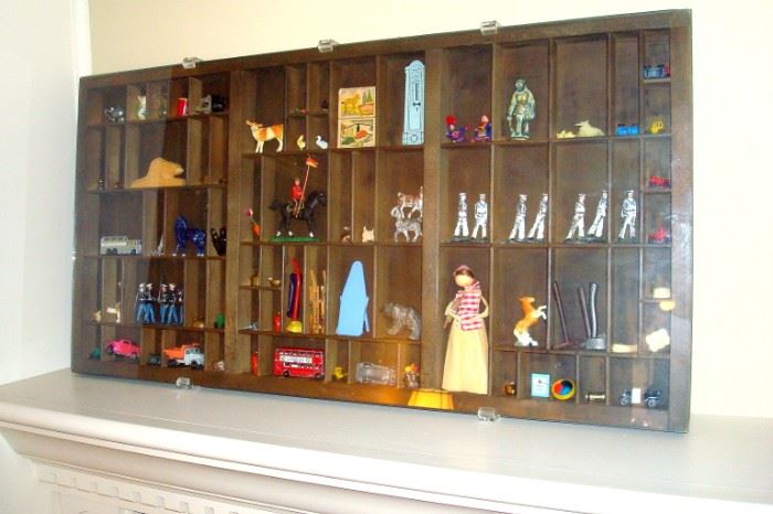 Shadowbox loaded with interesting and antique collectibles.