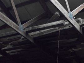 split rail fencing in rafters of the barn