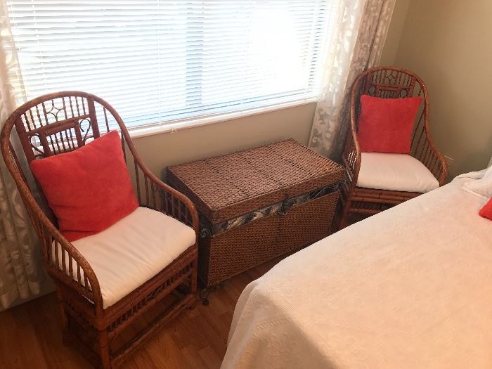 Pair of rattan chairs are sold.