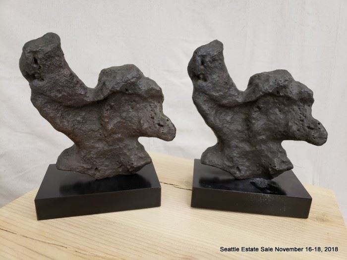 Unusual fossil-look sculpture on plinth.