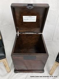 Mahogany-stained lift-top storage box.