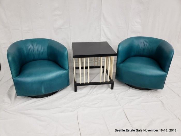 Teal barrel-back club chair.
Square-top side table with turned spindle supports