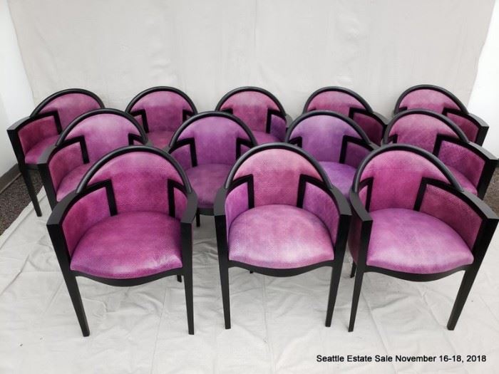 Set of 12 fuschia upholstered and ebonized frame dining chairs.