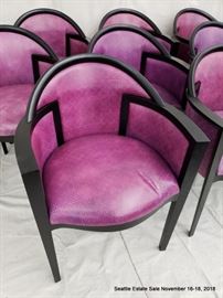 Set of 12 fuschia upholstered and ebonized frame dining chairs.
