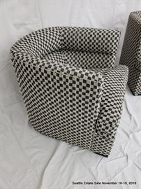 Black and white checked upholstered club chair.