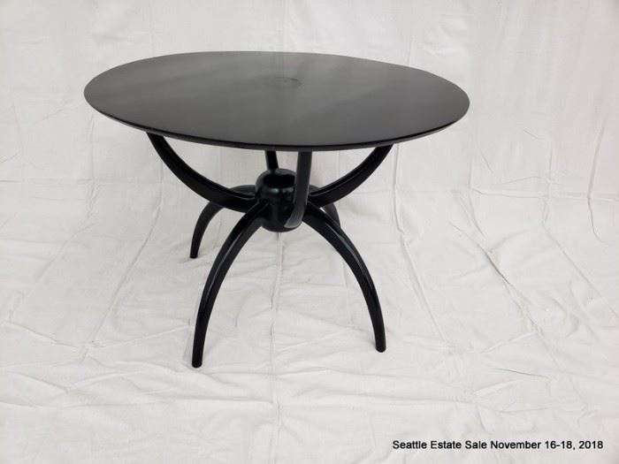 Round-top center table with ebonized finish