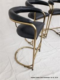 Set of four vintage tubular brass bar stools.