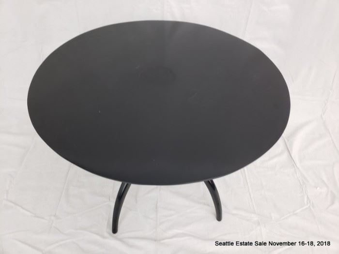 Round-top center table with ebonized finish