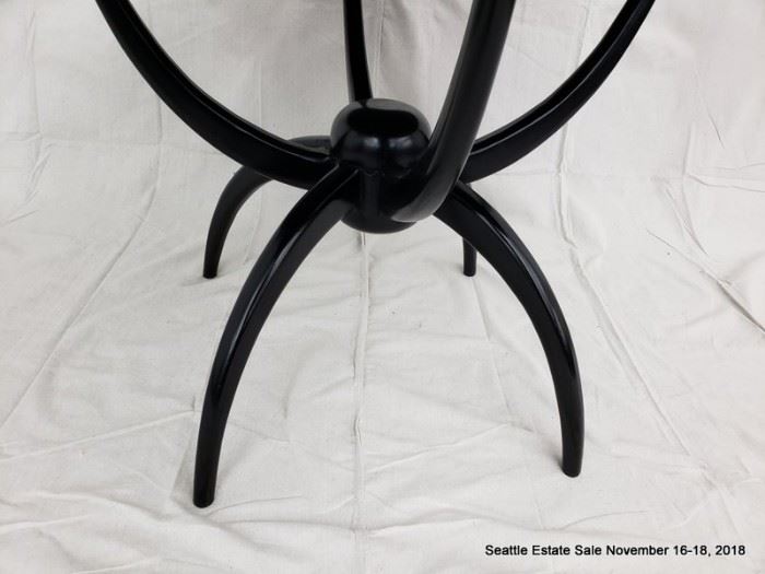 Round-top center table with ebonized finish