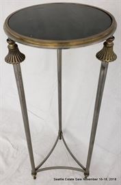 Patinated bronze and glass pedestal table with fluted accents