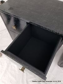 Four drawer side table in black and white cerused wood.