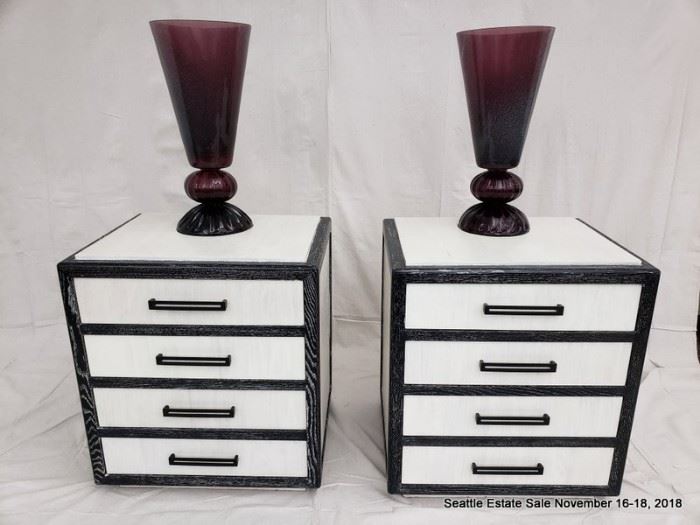 Two-tone, black and white cerused wood dresser with graduated drawers.