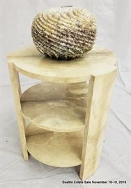 Three-level side table with marble-look finish.
Aggregate ombre-look vase.