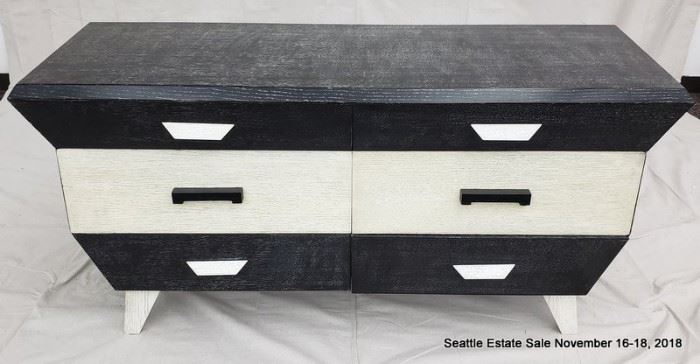 Four drawer side table in black and white cerused wood.