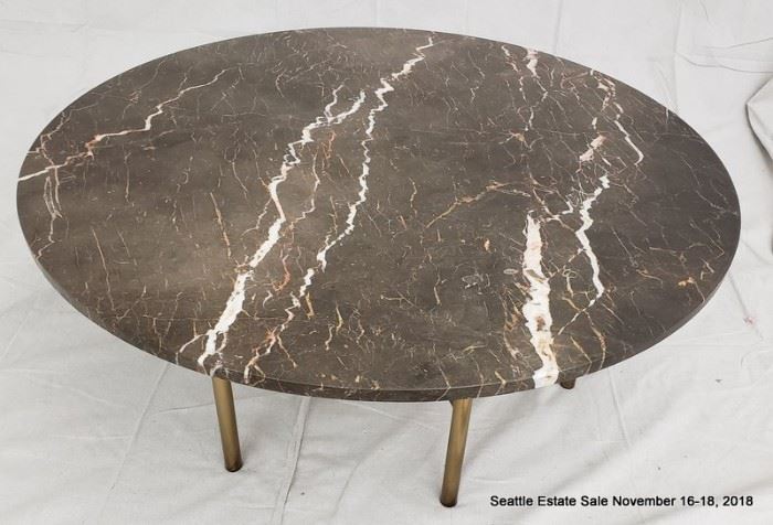 Large round patinated bronze and crackled glass coffee table.