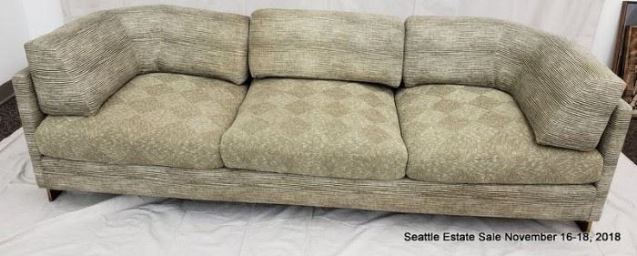 Bronze-framed upholstered sofa.