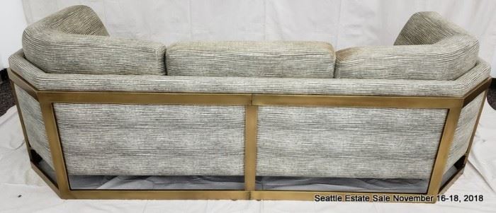 Bronze-framed upholstered sofa.