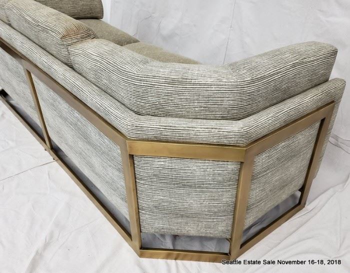 Bronze-framed upholstered sofa.