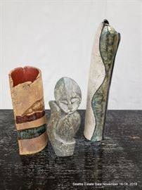 Hand-formed pottery vases and stone carving.