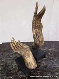 Gilt Buddhist hand on stand.