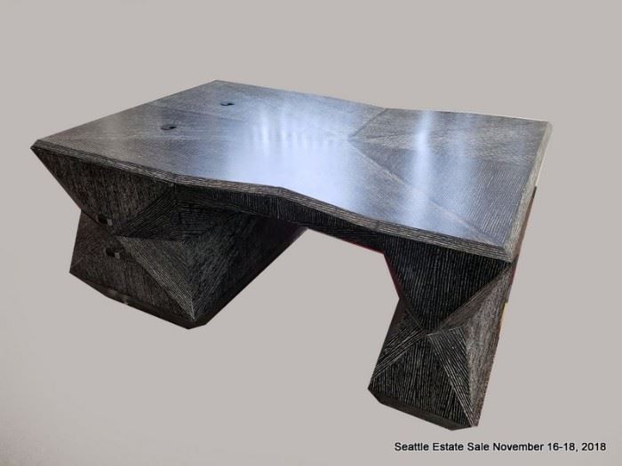 Angular black and white patterned cerused wood finish partners desk.