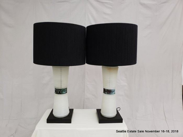 Table lamp with concentric graduated bases and patinated collar.