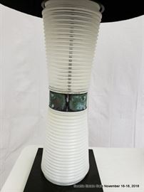 Table lamp with concentric graduated bases and patinated collar.