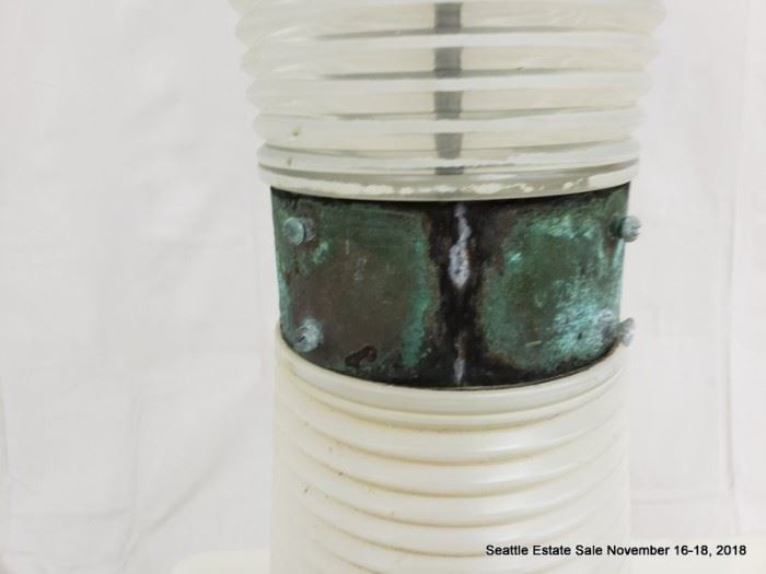 Table lamp with concentric graduated bases and patinated collar.