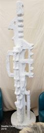 Mid-Century monumental hand-carved stone sculpture on rotating base.