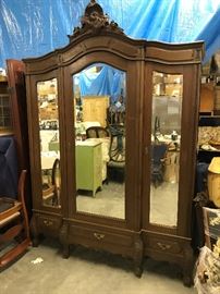 French Armoire, Beveled mirred doors, this is a break down that comes apart in pieces and goes back together like a glove. 3 drawers for extra storage, solid walnut