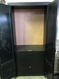 Inside the asian armoire, has 3 drawers, the inside in carved and hand painted doors inside, that show beatifully when open