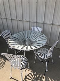 Strap Table with glass top and a place for umbrella