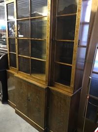Beautiful Asian China cabinet with subtle hand painting, cabinet lights up to show off china on the glass shelves