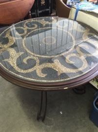 Inlaid travertine tile table with iron base