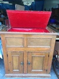 Early pritimive ice box, with original shelves in the bottom behind the doors . lots of storage