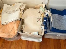 Bins of vintage to new rugs/linens