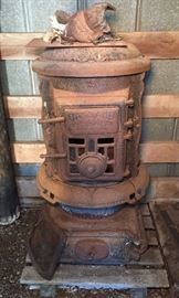 Featuring an early 1900's Oakland cast iron parlor stove No 18 made by the Wehrle co from Newark Ohio. Approximately 25" x 43"