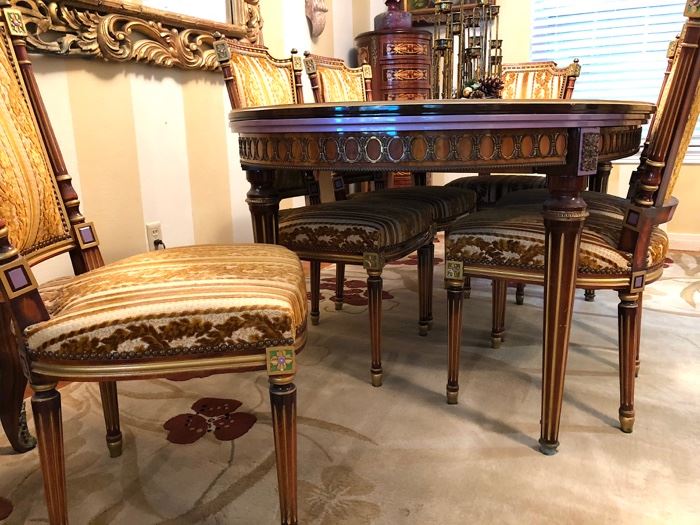 Beautifully Crafted Louis XVI Style Oval Dining Table with Ornate Floral & Ribbon Inlay & Walnut Crossbanding & Bronze Accent at Apron. Chair in Same Style with Gold Gilt & Pearl Accents, Upholstered Seats and Back. 