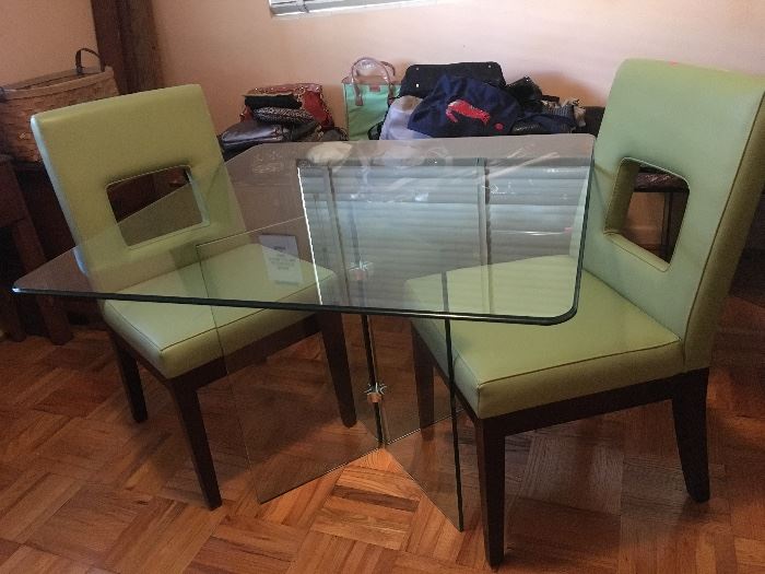 This glass dining table has matching end tables and a coffee table to go with it.