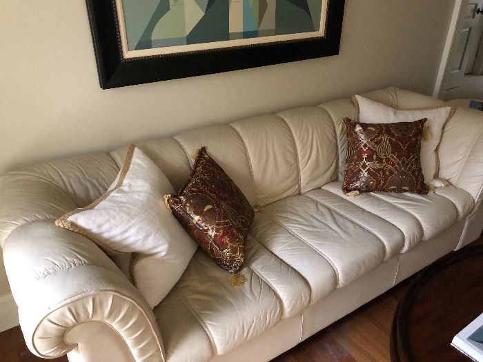 Cream leather sofa. 84" long. Asking $120
